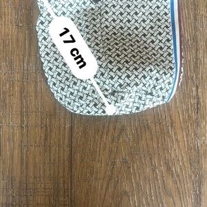 Juicy Couture small Vinyl pouch. Gold draw string.